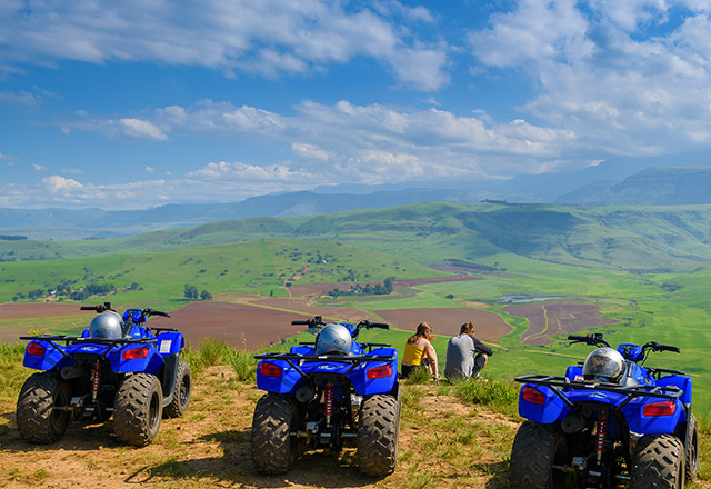 Quad bikes overlooking a valley